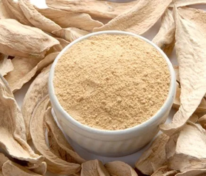 a bowl of powder in a circle of dried leaves
